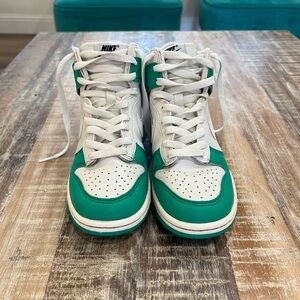 Nike kids shoe size 4.5 in white and green.